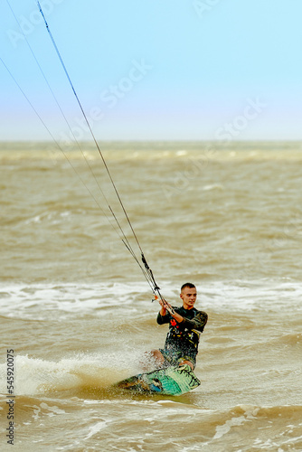 Young Man KiteBoarding on the waves Extreme Sport Kitesurfing © Fat Bee