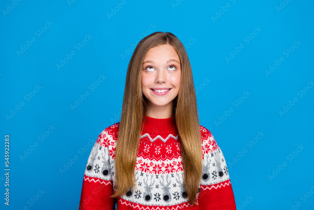 Photo of adorable pretty girlish lady interested look empty space low prices gifts season sale deal isolated on blue color background Photo of adorable pretty girlish lady interested look empty space low prices gifts season sale deal isolated on blue color background