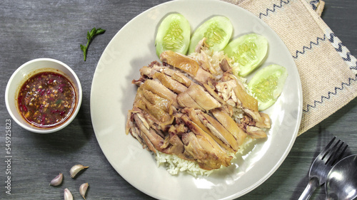 steamed rice topped with chicken Serve with ginger sauce.