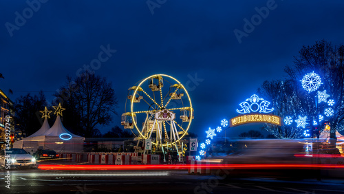 White magic christmas market with ferris wheel funfair at Jungfernstieg in Hamburg