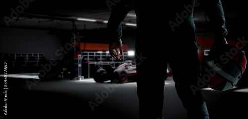 Silhouette of a racing pilot entering the pitlane garage with sports car prepared for a race © supamotion