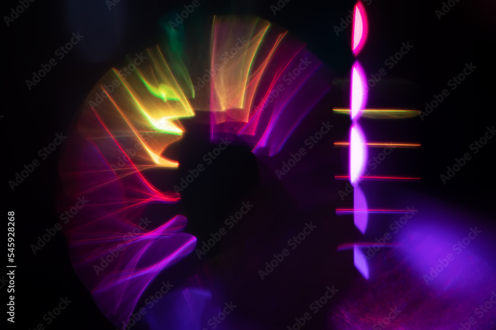 Abstract blurred colorful lens flare bokeh on black,