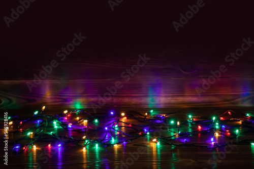 Fototapeta Naklejka Na Ścianę i Meble -  Christmas background with lights and free text space. Christmas lights border.