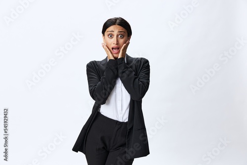 Business woman in black business suit shows signals gestures and emotions on white background, freelancer job online time management, teacher science
