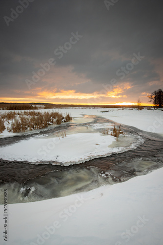 landscape - river covered with snow in winter