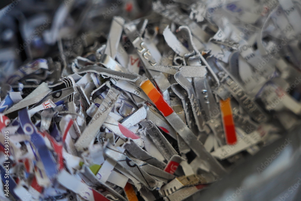 Fototapeta premium Recycled bank card. Recycled Documents. Remains of documents after disposal.