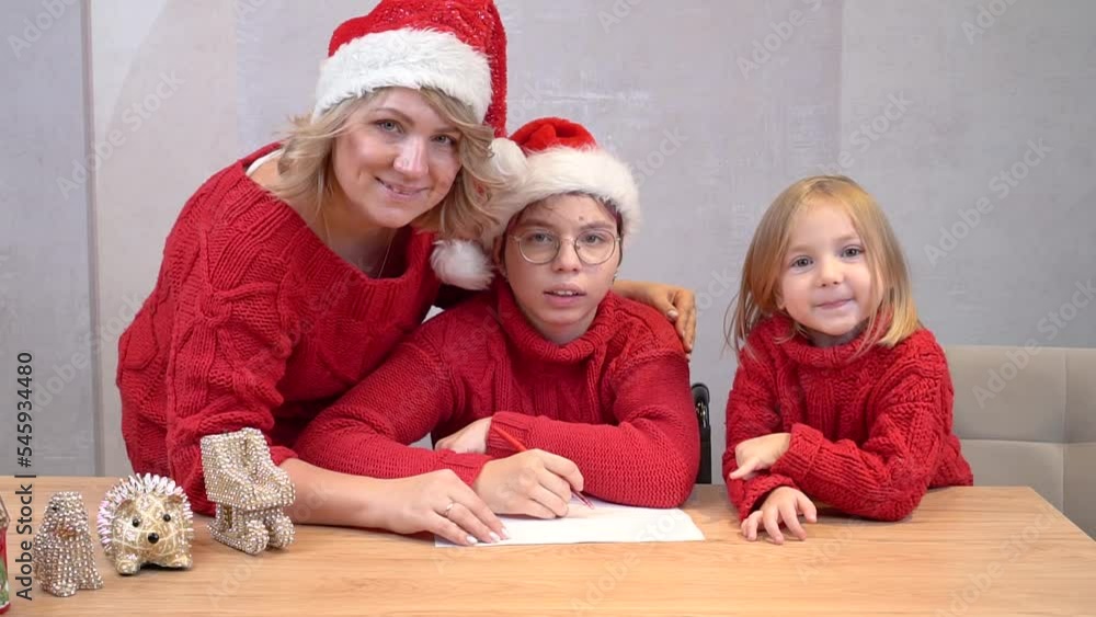 Portrait of a family in Christmas red sweaters and Santa Claus hats. Portrait of a family in Christmas red sweaters and Santa Claus hats.