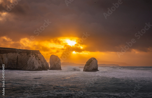 Fotografie, Obraz Stormy November sunrise at Freshwater Bay and Stag rock Isle of Wight south east
