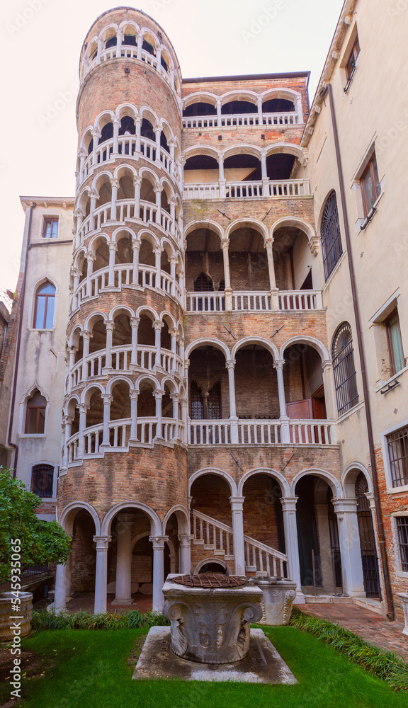 Old medieval stone spiral staircase in Venice.