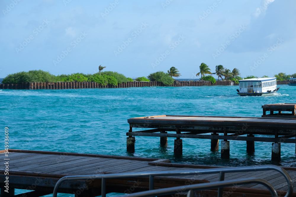 The harbour at Male International Airport Maldives with ferry crossing around. The harbour at Male International Airport Maldives with ferry crossing around.