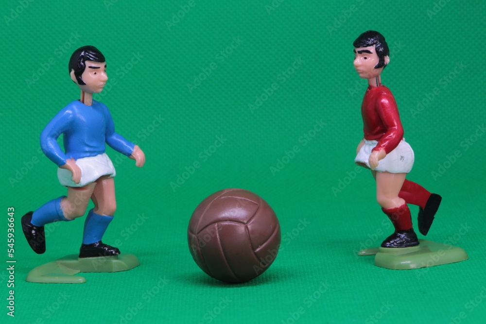 Football Soccer figures in red , blue, white kit ,  Football players challenge , ready to tackle for the football,  vintage toys from 1970s -1980s, Soccer action figure. 