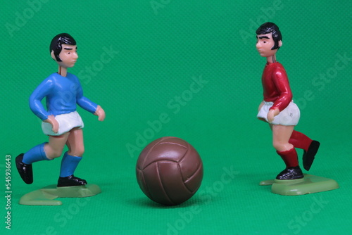 Football Soccer figures in red , blue, white kit ,  Football players challenge , ready to tackle for the football,  vintage toys from 1970s -1980s, Soccer action figure. 