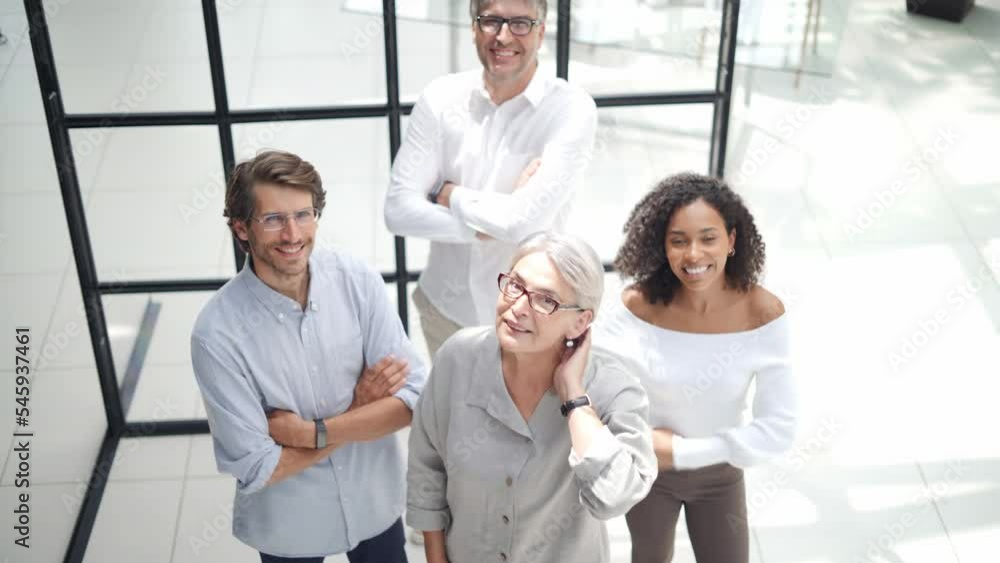 group of successful business people standing together and looking at the camera. group of successful business people standing together and looking at the camera.
