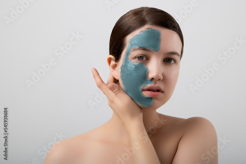 Woman spa mask half-face beauty concept . photo