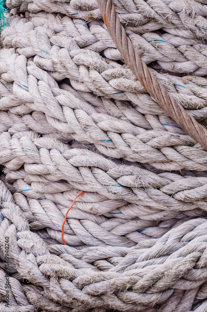london, united kingdom, october 22, 2022: close-up of an old frayed boat rope as a nautical background