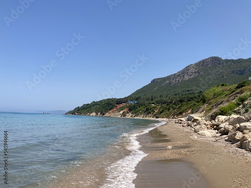 Rocky Prasoudi beach in Corfu island, Greece, in summer time