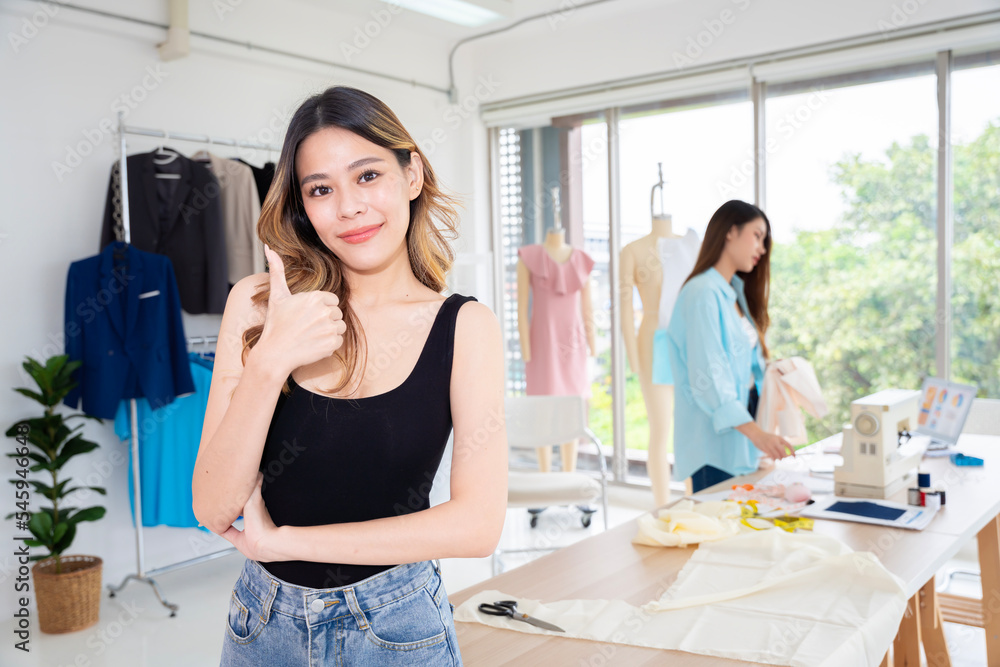 Two Asian women working together Small business, SME, tailoring designs for customers. Both of them acted as great designers. Two Asian women working together Small business, SME, tailoring designs for customers. Both of them acted as great designers.