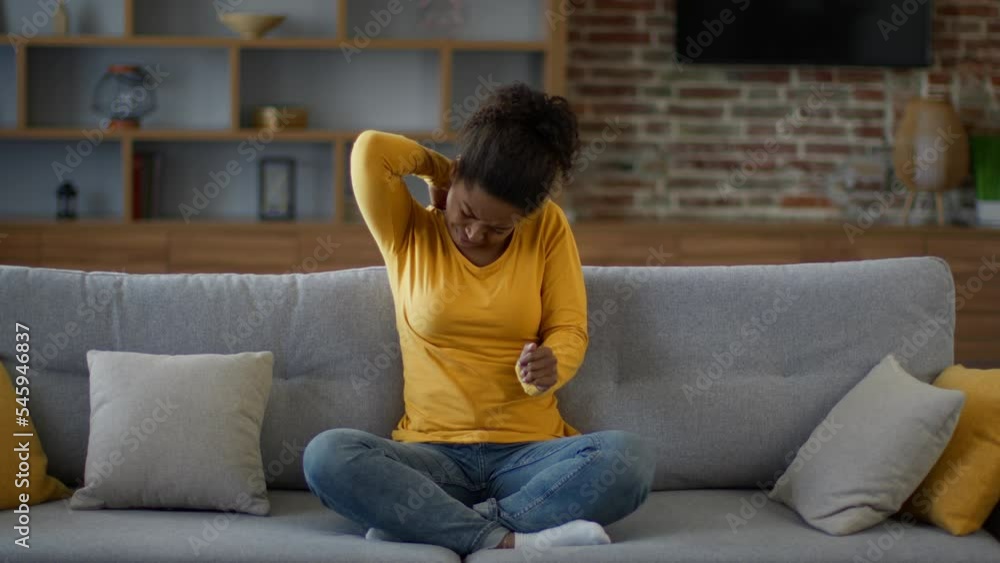 Allergy attack. Young irritated african american woman scratching neck, suffering from annoying rash on skin, free space