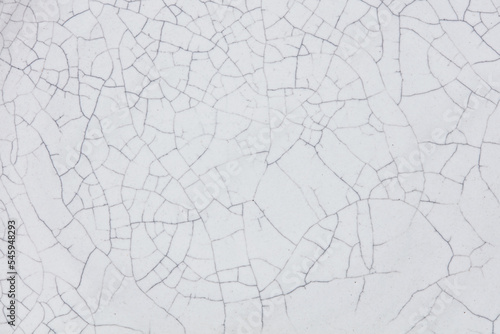Cracked ceramic texture. Cracked white ceramic background.
