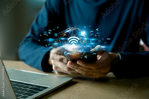 Business using smartphone ,with wifi icon,business communication social network concept.