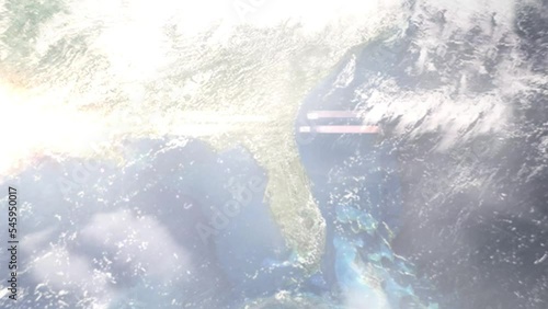 Earth zoom in from outer space to city. Zooming on Gainesville, Florida, USA. The animation continues by zoom out through clouds and atmosphere into space. Images from NASA photo