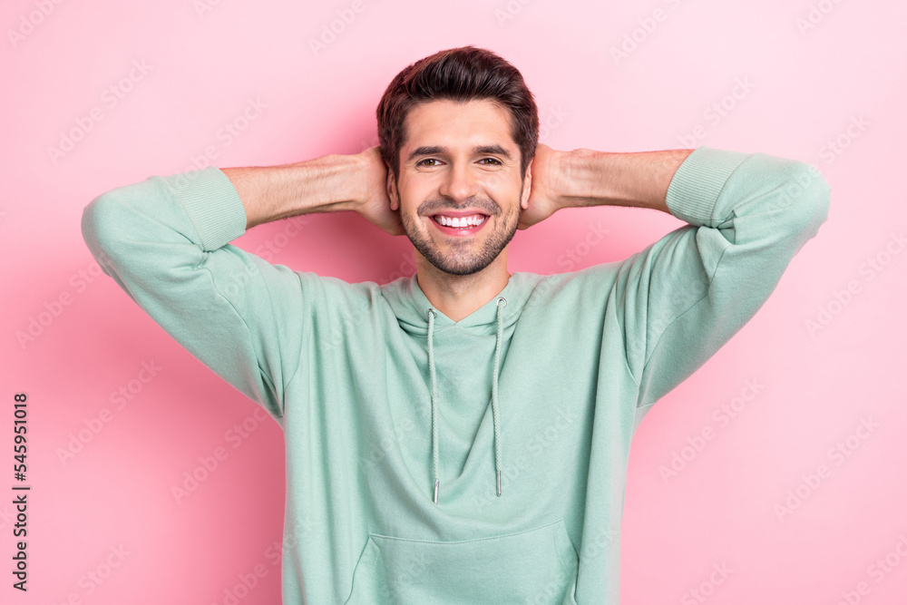 Portrait of satisfied friendly person beaming smile arms behind head isolated on pink color background Portrait of satisfied friendly person beaming smile arms behind head isolated on pink color background