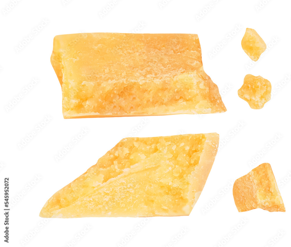 Pieces of parmesan cheese isolated on white background. Hard mature cheese Parmesan, Parmigiano in rough cubes top view, flat lay..
