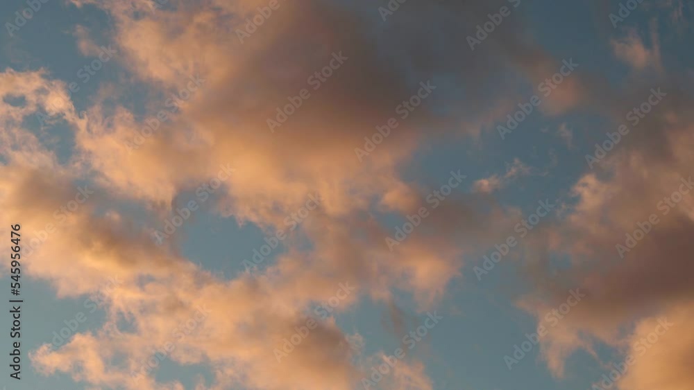 Dramatic sky with passing red, yellow, orange clouds during sunset during windy evening Dramatic sky with passing red, yellow, orange clouds during sunset during windy evening