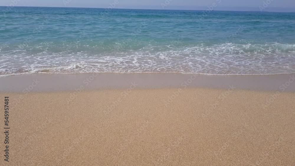 Beautiful blue turbulent Mediterranean sea and beach with fine sand	