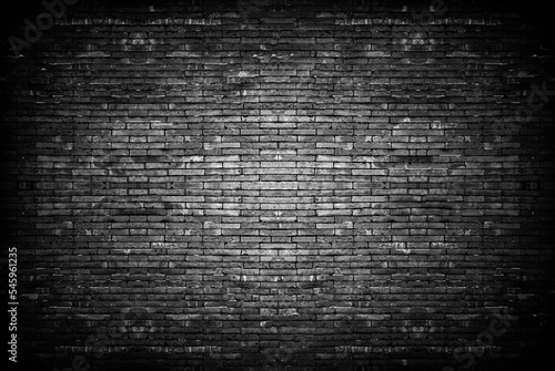 Old vintage retro style dark bricks wall for abstract brick background and texture.