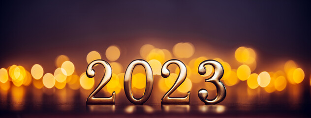Happy New Year 2023 - golden numbers in holiday night