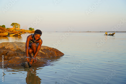 Fotografija Beautiful African woman fetching water from the River