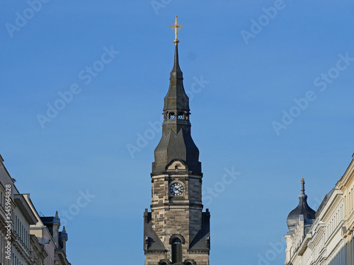Blick auf Kirchturmspitze und Turmuhr der Michaeliskirche. Leipzig, Sachsen, Deutschland photo