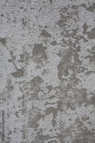 Dirty rough surface texture of sand screed cement, old gray concrete wall for background with uneven stains and tiny holes.