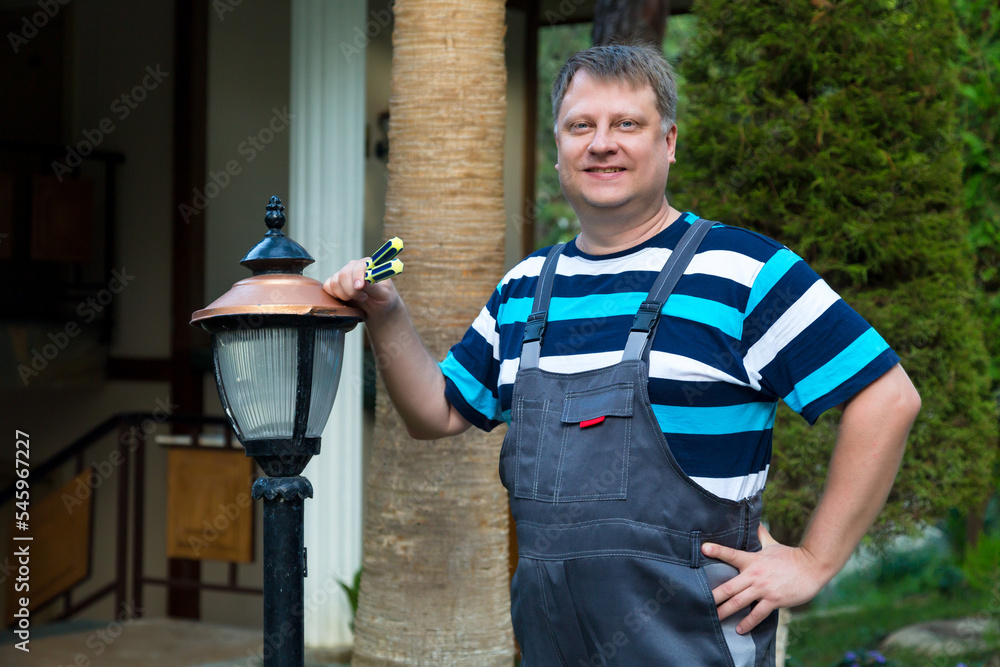 Portrait of professional worker with screwdriver in his hand outdoors. Portrait of professional worker with screwdriver in his hand outdoors.