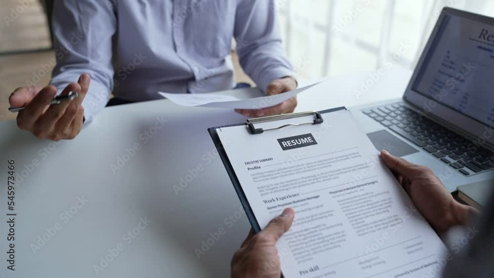 Businessman having an interview for a job, Company hr reading candidate's CV, and interviewing Businessman having an interview for a job, Company hr reading candidate's CV, and interviewing
