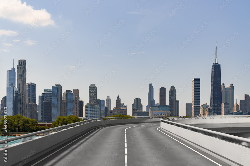 Empty urban asphalt road exterior with city buildings background. New modern highway concrete construction. Concept of way to success. Transportation logistic industry fast delivery. Chicago. USA. Empty urban asphalt road exterior with city buildings background. New modern highway concrete construction. Concept of way to success. Transportation logistic industry fast delivery. Chicago. USA.