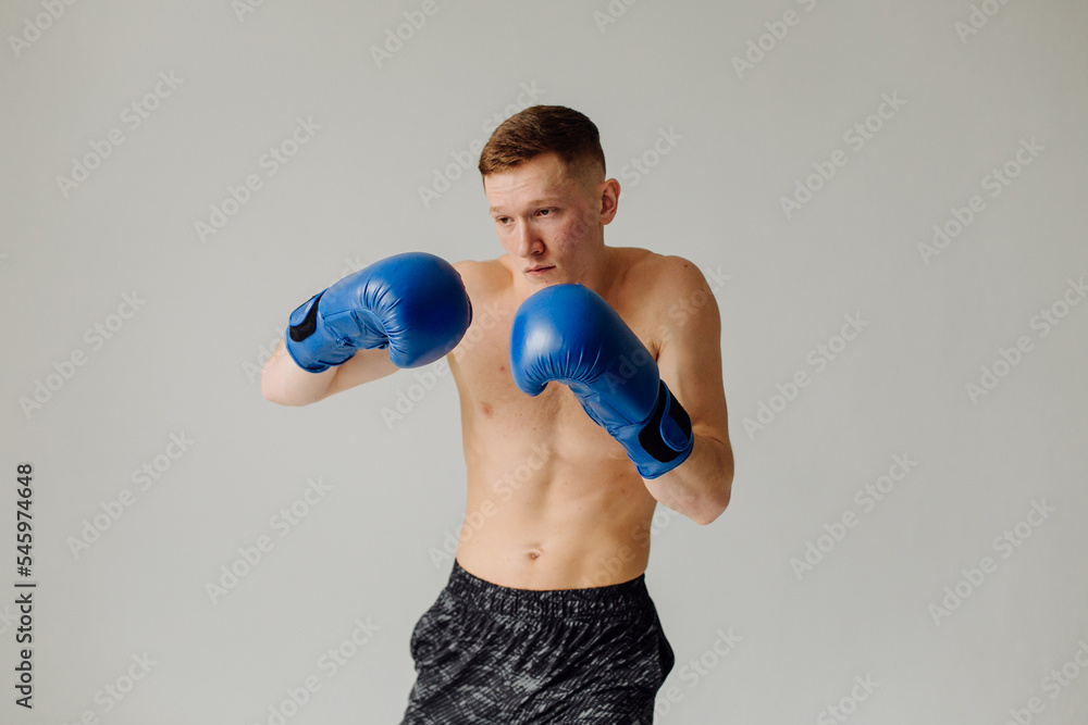 Athletic young man doing workouts at home, man doing training, warm up before weight exercise. Athletic young man doing workouts at home, man doing training, warm up before weight exercise.