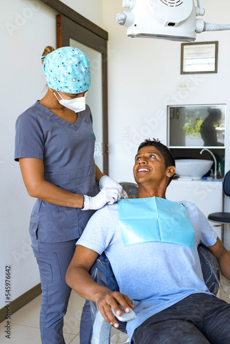 Dentist explains treatment to his patient.