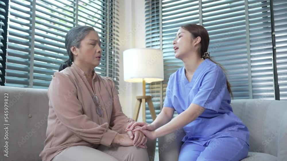 Elderly caregivers or nurses providing care and giving advice to elderly woman in nursing home. Elderly caregivers or nurses providing care and giving advice to elderly woman in nursing home.