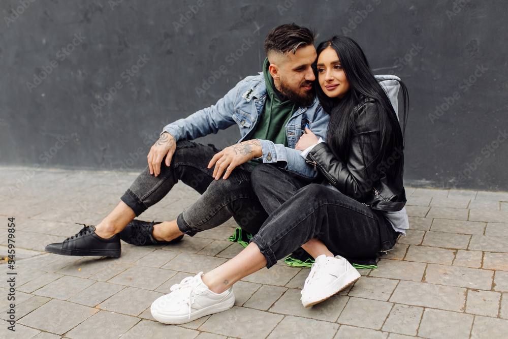 Outdoor happy couple in love posing near cafe Outdoor happy couple in love posing near cafe