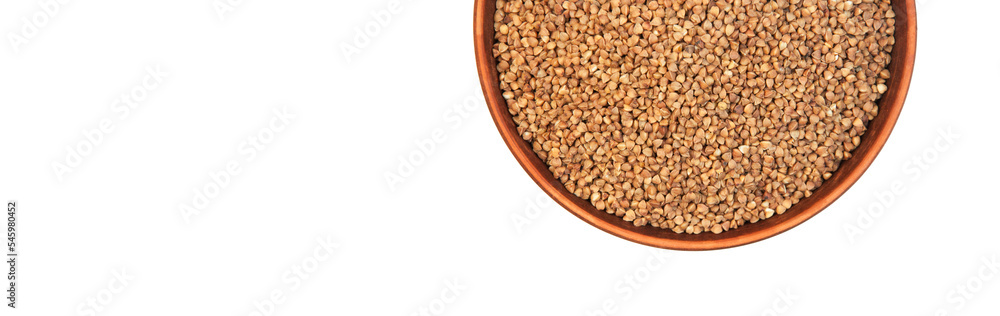 buckwheat in a clay bowl on a white background. the concept of a good harvest of buckwheat buckwheat in a clay bowl on a white background. the concept of a good harvest of buckwheat