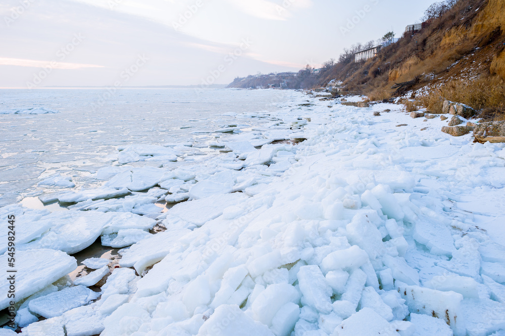 The frozen winter Azov sea on the beach of Taganrog city, Rostov region of Russia The frozen winter Azov sea on the beach of Taganrog city, Rostov region of Russia