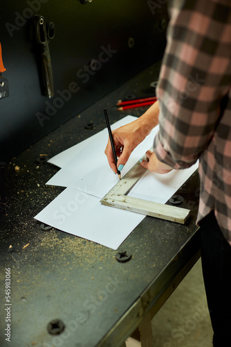 Female interior designer working on drawings, woman architect draws