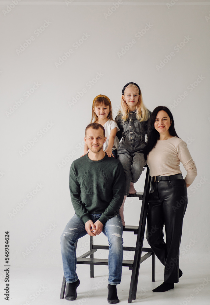 Obraz premium Childhood, fun, family concept. Fashionable sisters posing.