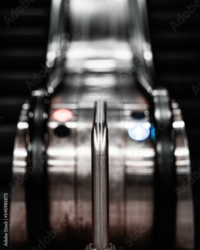 Vertical shot of the steel railings of an escalator Fototapet