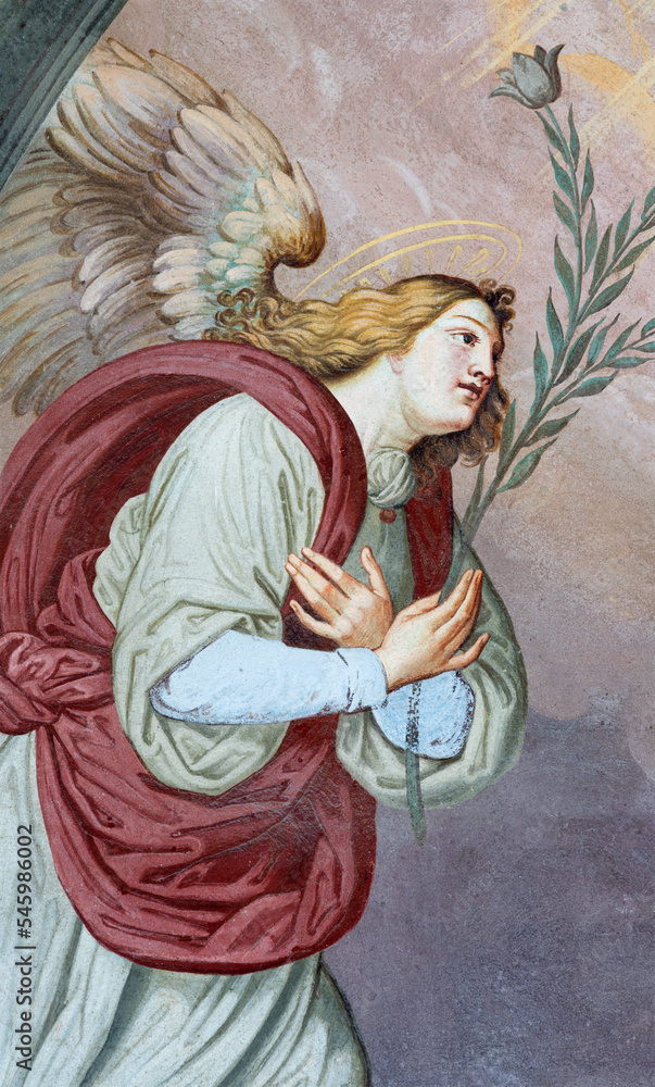 ALAGNA, ITALY - JULY 16, 2022: The fresco of Archangel Gabriel from Annunciation on the facade of church  San Giovanni Battista by Alonzo and Giuseppe Antonio Avondo (1843).