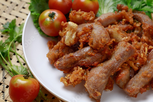 Thai food, fried pork with garlic The concept of popular Thai food in Lanna style.