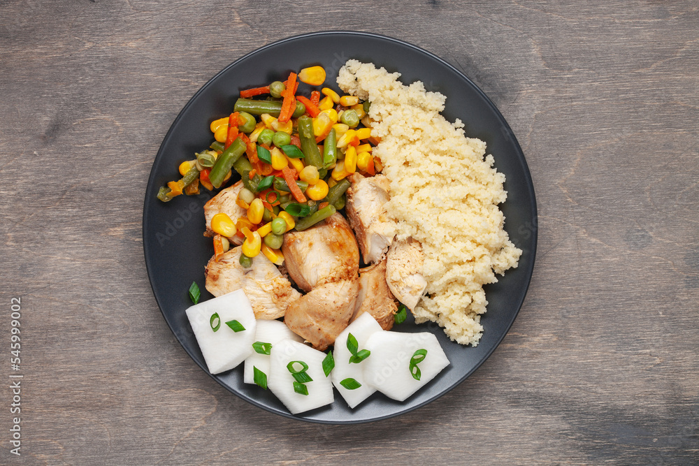 Diet lunch - chicken breast with couscous and  vegetables .  Top view