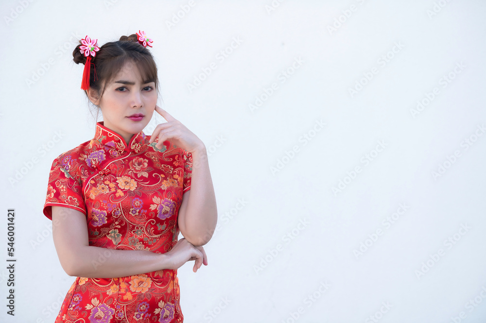 Portrait beautiful asian woman in Cheongsam dress on white background,Thailand people,Happy Chinese new year concept,Happy asian lady in chinese traditional dress Portrait beautiful asian woman in Cheongsam dress on white background,Thailand people,Happy Chinese new year concept,Happy asian lady in chinese traditional dress